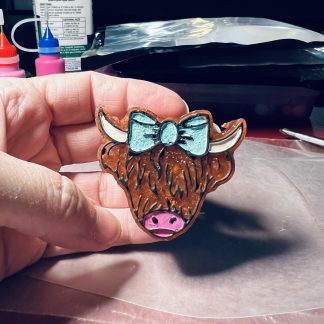 Highland Cows with a Bow